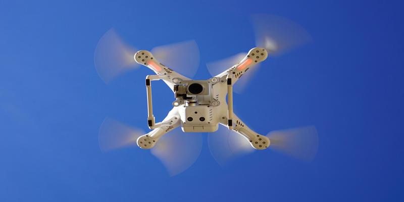 A drone flying in the sky
Description automatically generated